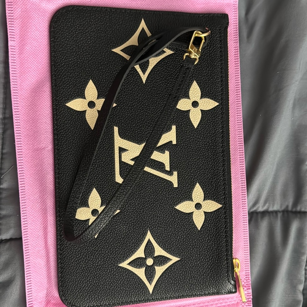 Louis Vuitton  black beige wristlet
No longer want it